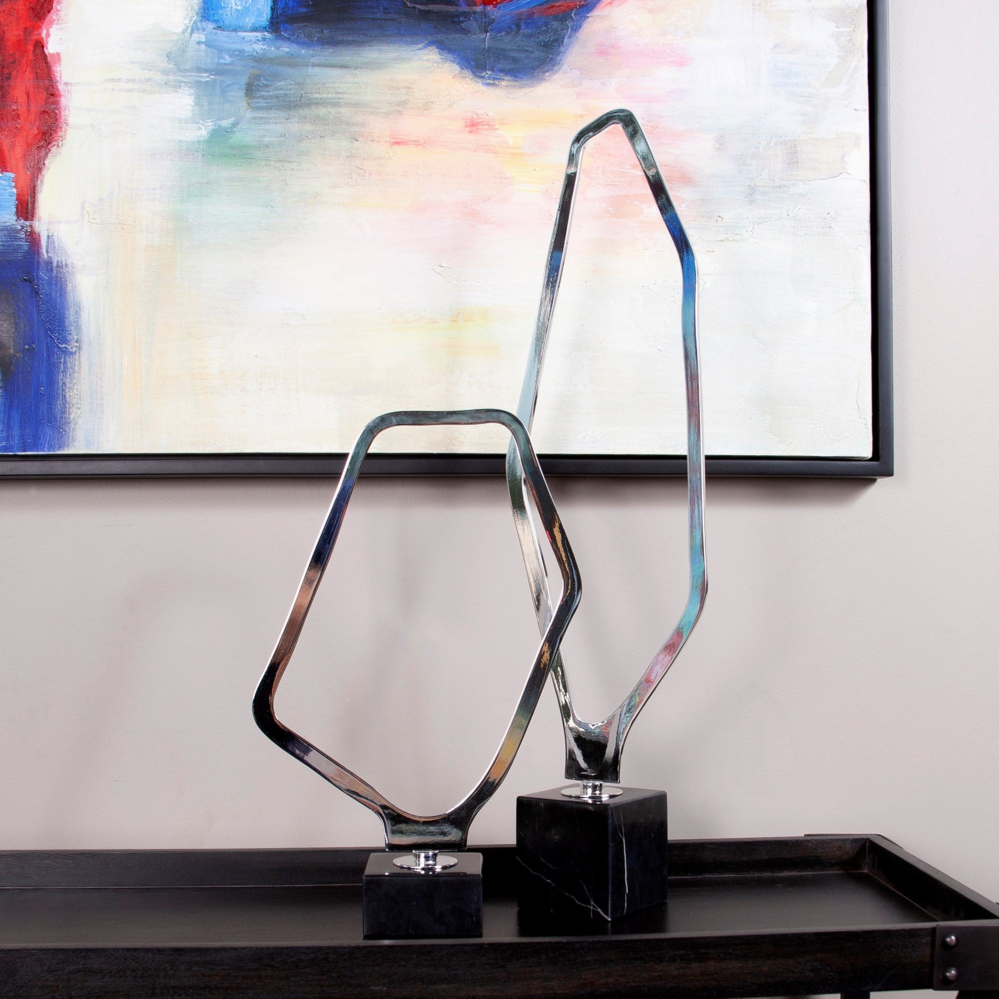 Tall Chrome Geometric Sculpture on Black Marble Base